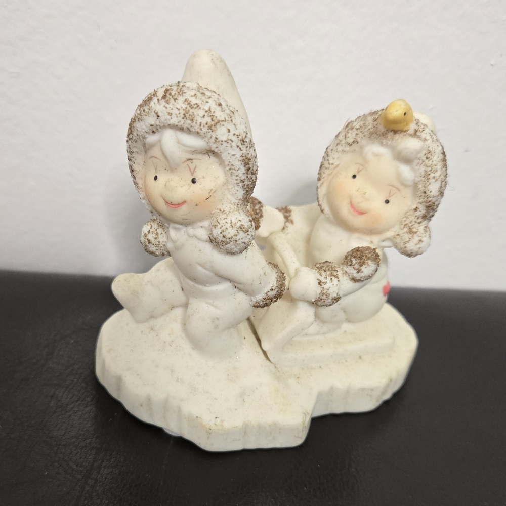 Wellington Collection Porcelain Figurine Hitching a Ride On Sled 3" Tall Figure